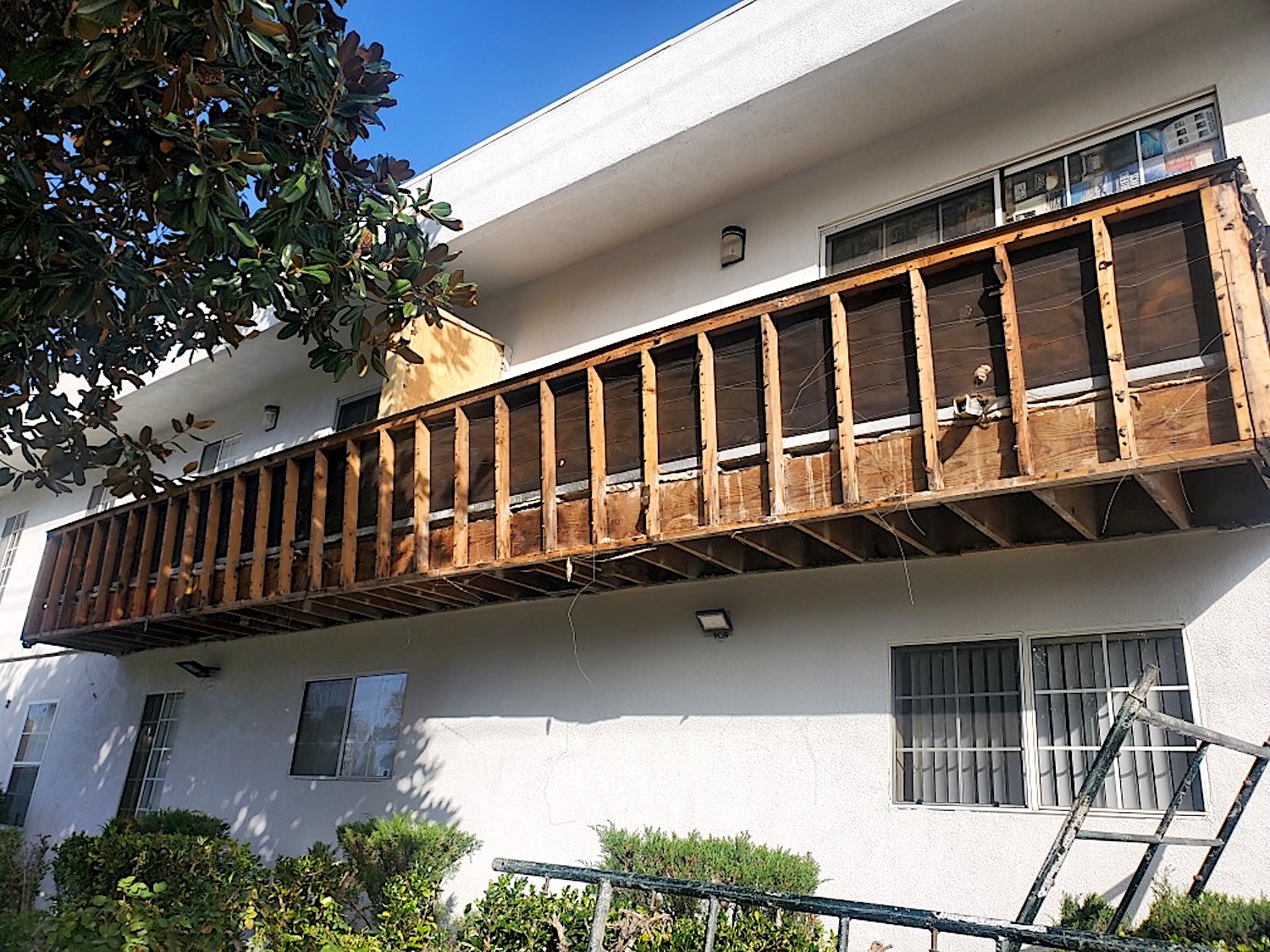 View of balcony being repaired at a Los Angeles apartment building.
